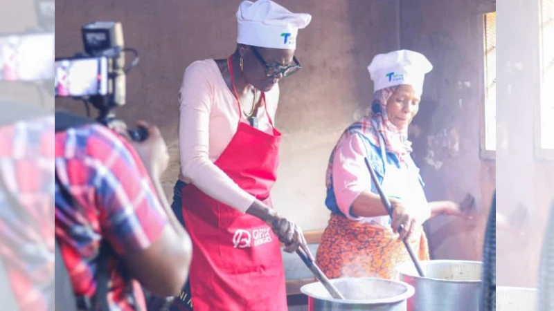 Speaker of the National Assembly, Dr Tulia Ackson cooks at one of the restaurants in Uyole street,  Mbeya Region.