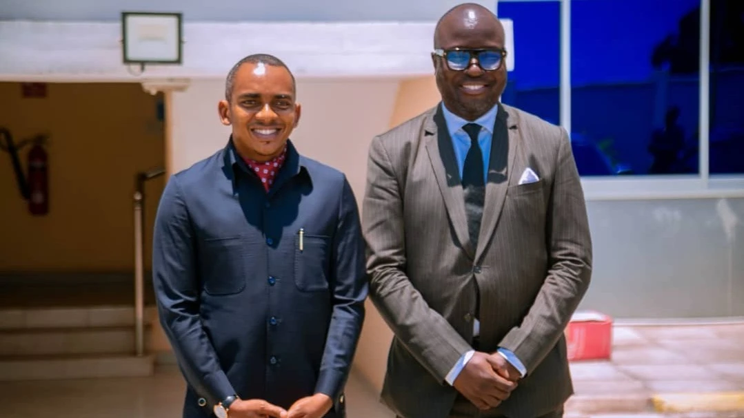 Jerry Silaa (L), Minister of Information, Communication, and Information Technolog and ICT Commission Director General,Dr. Nkundwe Mwasaga, pose in a photo shortly after their discussion held in Dar es Salaam yesterday.