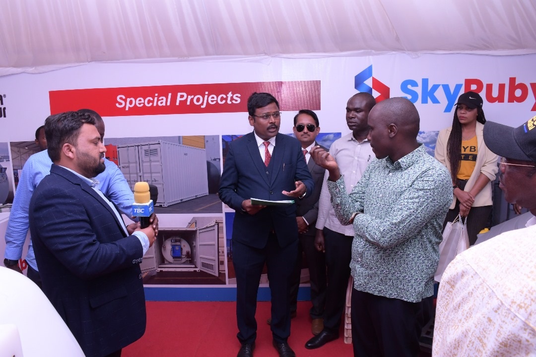 Deputy Prime Minister and Minister of Energy, Dotto Biteko (R), gets information from the Managing Director of Sky Ruby Pvt Ltd, Mayur Baburao Gavali (2nd R) about the company that specializes in equipment for storing flammable materials such as petrol 