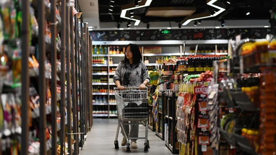 A consumer shops at a supermarket in Shaoyang, central China's Hunan Province, April 11, 2024.