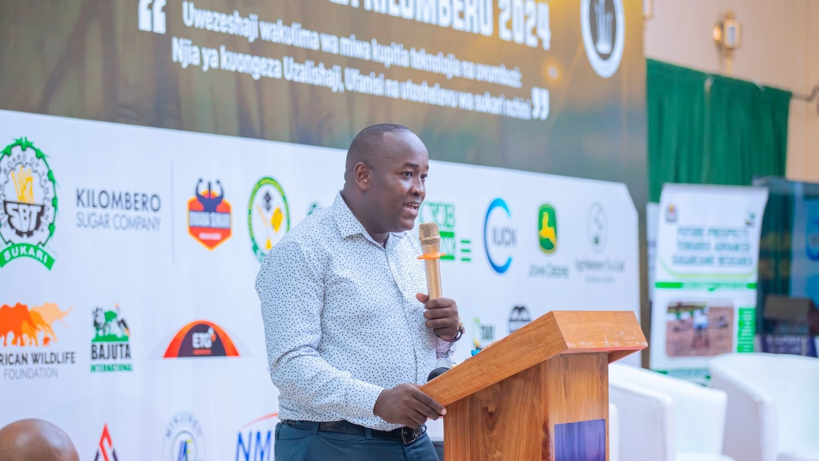 Chairman of the Kilombero sugarcane farmers' day exhibition and Communications and Stakeholder Relations Manager at Kilombero Sugar Victor Byemelwa address sugar cane farmers and stakeholders during the opening of the dialogue ahead.