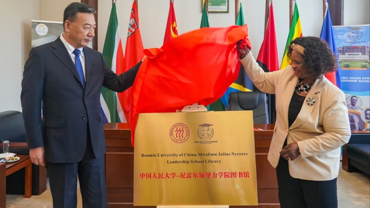 Zhang Donggang (L), Party secretary of the Renmin University of China, Prof Marcellina Chijoriga, (R) Principal of the Mwalimu Julius Nyerere Leadership School, inaugurate the Renmin University of China-Mwalimu Julius Nyerere Leadership School library