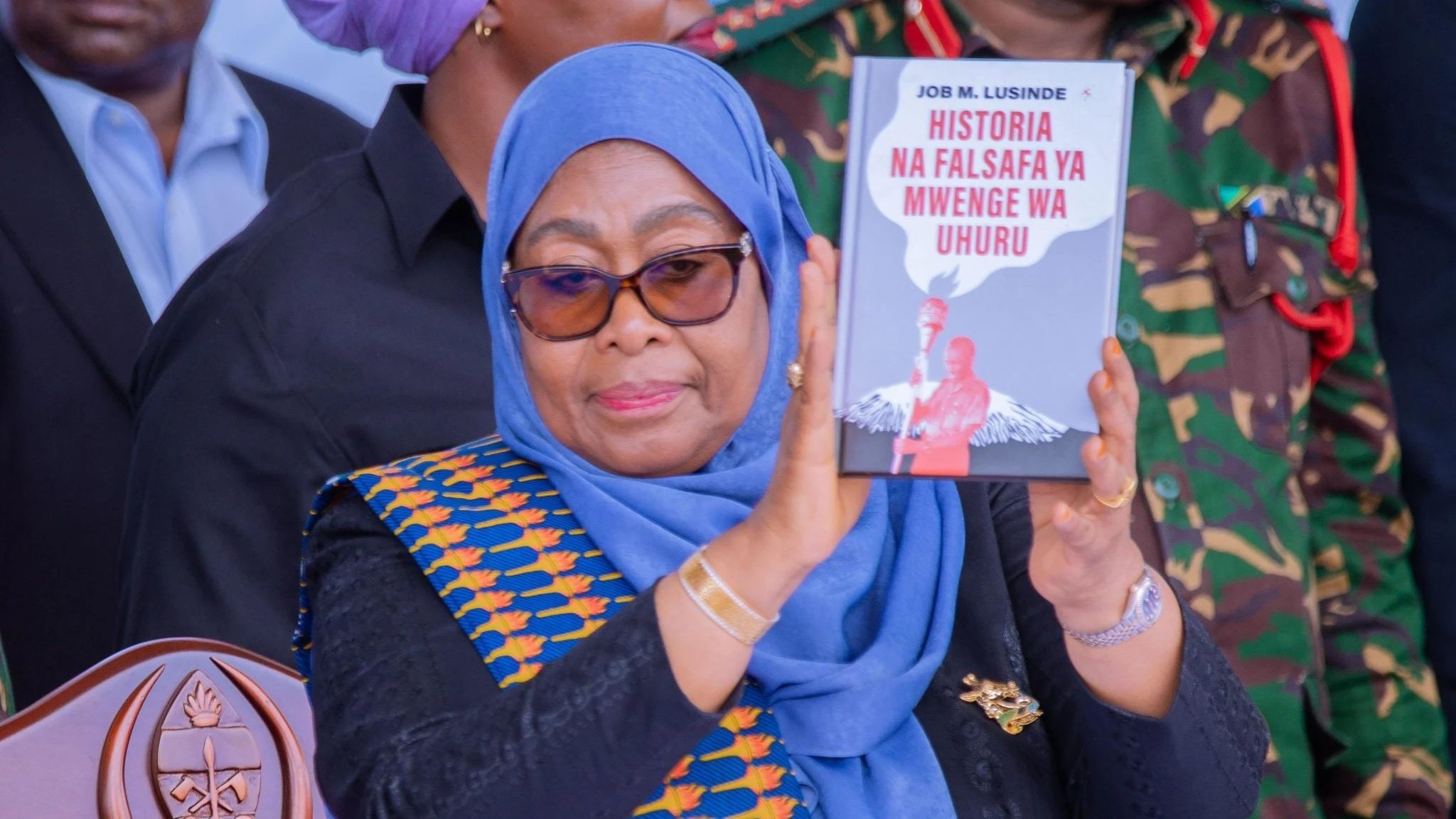 President Samia Suluhu Hassan showcasing Uhuru Torch history book she launched today, during the climax of the 2024 National Uhuru Torch Race held at  Furahisha Grounds in Mwanza Region.