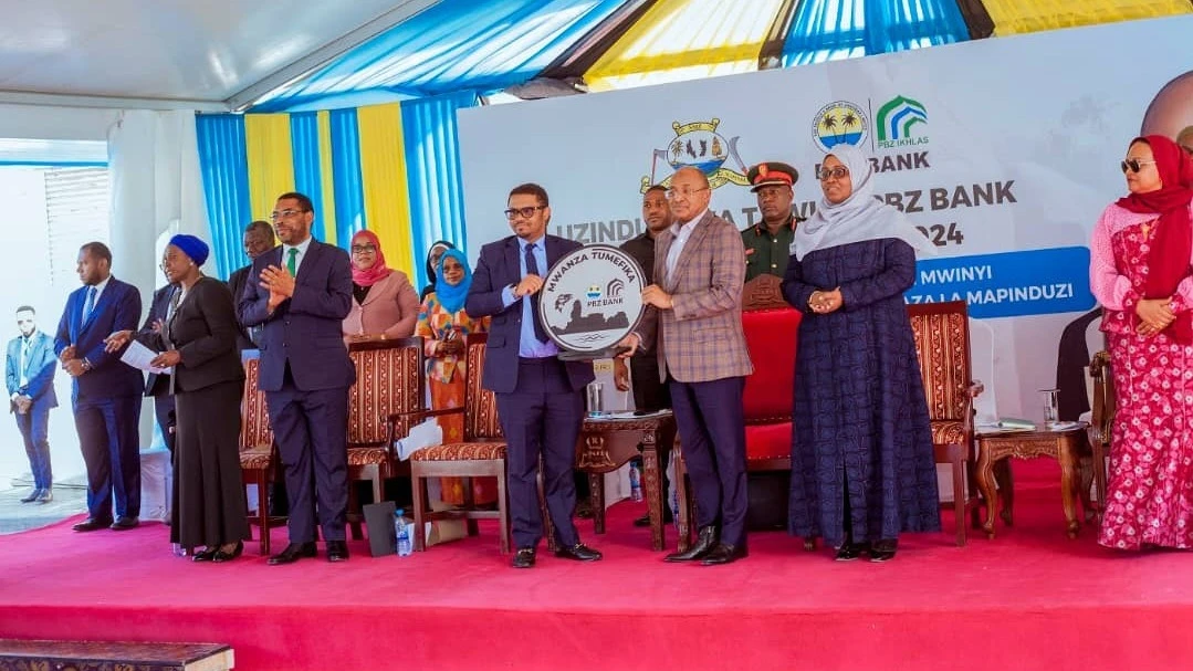 President Dr Hussein Ali Mwinyi (3 rd-Right) pictured in Mwanza over the weekend during the inauguration of a new branch of the People's Bank of Zanzibar (PBZ) in the Region.

