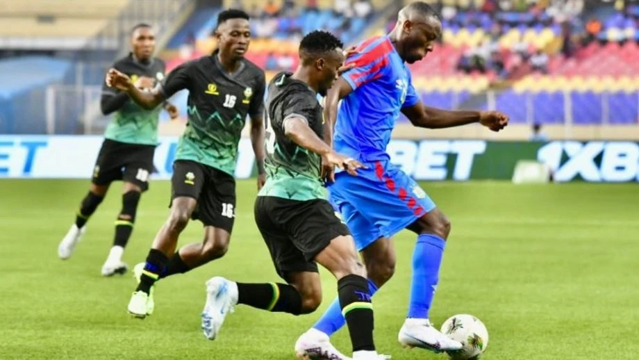 Three Taifa Stars players fight for the ball with a DR Congo player during their AFCON Morocco 2025 qualifiers Group H match at Stade Des Marty’s in Kinshasa last Thursday. DR Congo won 1-0.