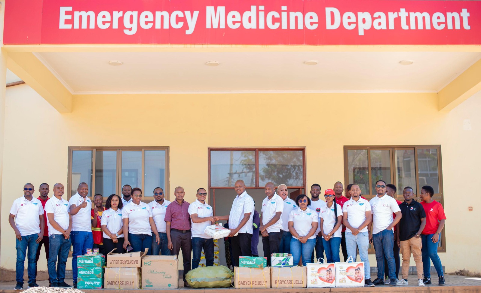 Vodacom Tanzania Plc's Northern Zone Executive Head, George Venanty (left), hands over donations to Dr. Vena Karia (right) of Mawenzi Referral Hospital for patients, as part of Customer Service Week. 