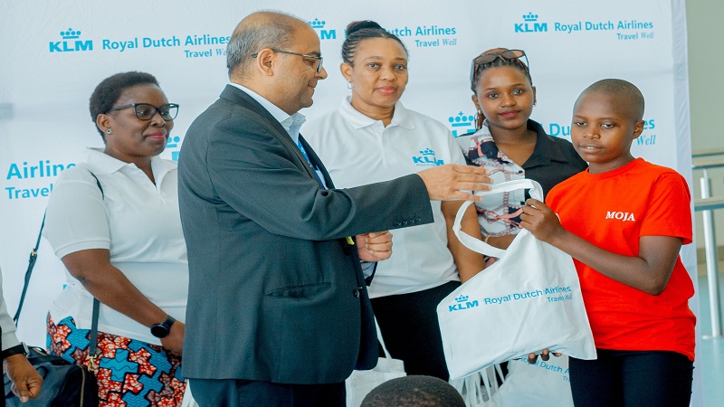 Air France-KLM’s Tanzania Country manager Rajat Kumar pictured at Dar es Salaam’s Julius Nyerere International Airport recently presenting an International Day of the Girl Child gift to one of the girls cared for at the city’s Ebenezer Centre. 