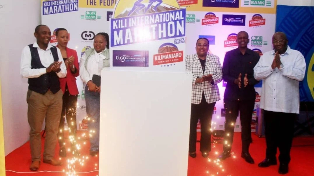 The Minister for Natural Resources and Tourism, Ambassador Dr. Pindi Chana (3rd R) and the Tanzania Breweries Limited Marketing Director, Khensani Mkhombo (3rd L) leading other dignitaries in launching the Kilimanjaro Premium Lager International Marathon 