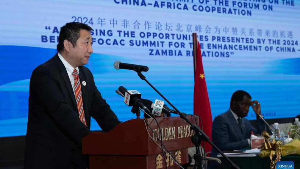 Chinese Ambassador to Zambia Han Jing (L) speaks during a roundtable meeting aimed at assessing the opportunities presented by the 2024 Summit of the Forum on China-Africa Cooperation for enhancing China-Zambia relations held in Lusaka, Zambia, Oct. 18