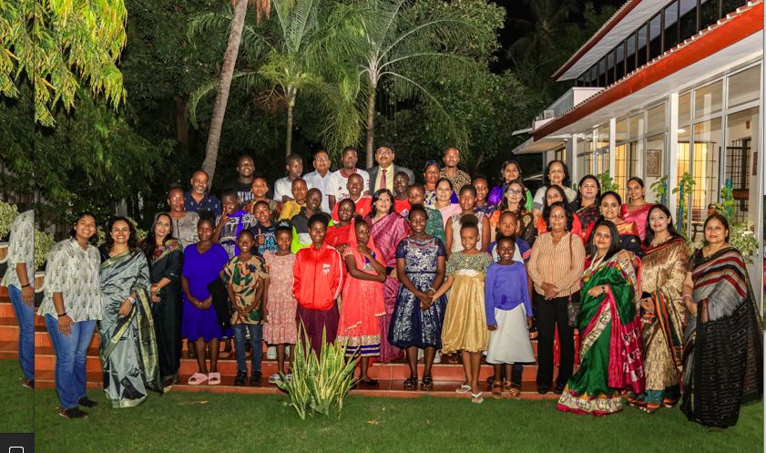 India’s High Commissioner to Tanzania, Bishwadip Dey (C, in tie) poses for a souvenir photo with children from Sarah House Orphanage of Mwandege village in Coast Region and members of Dar es Salaam Indian Women’s Association (DIWA) 