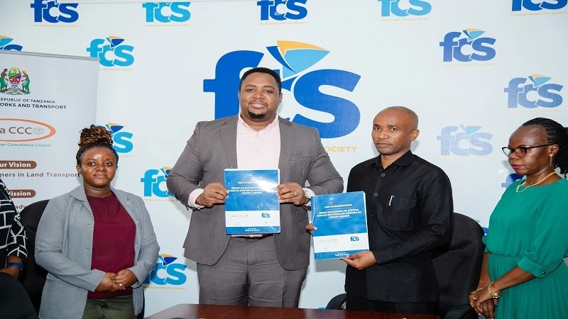 Foundation for Civil Society executive director Justice Rutenge and LATRA CCC executive secretary Daudi Goodluck,  pictured in Dar es Salaam yesterday during  signing of a partnership agreement.