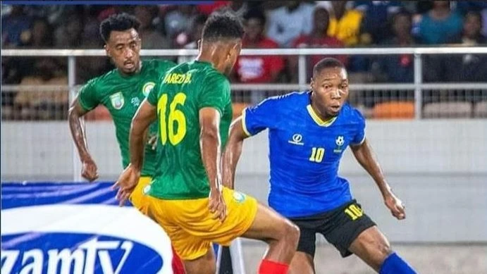 Tanzania's senior national soccer side's forward, Clement Mzize (R), negotiates his way past Ethiopia's Abinet Demissie (L) and Yared Baye in the Group H match of the 2025 Africa Cup of Nations qualifiers in Dar es Salaam on September 4, this year. 