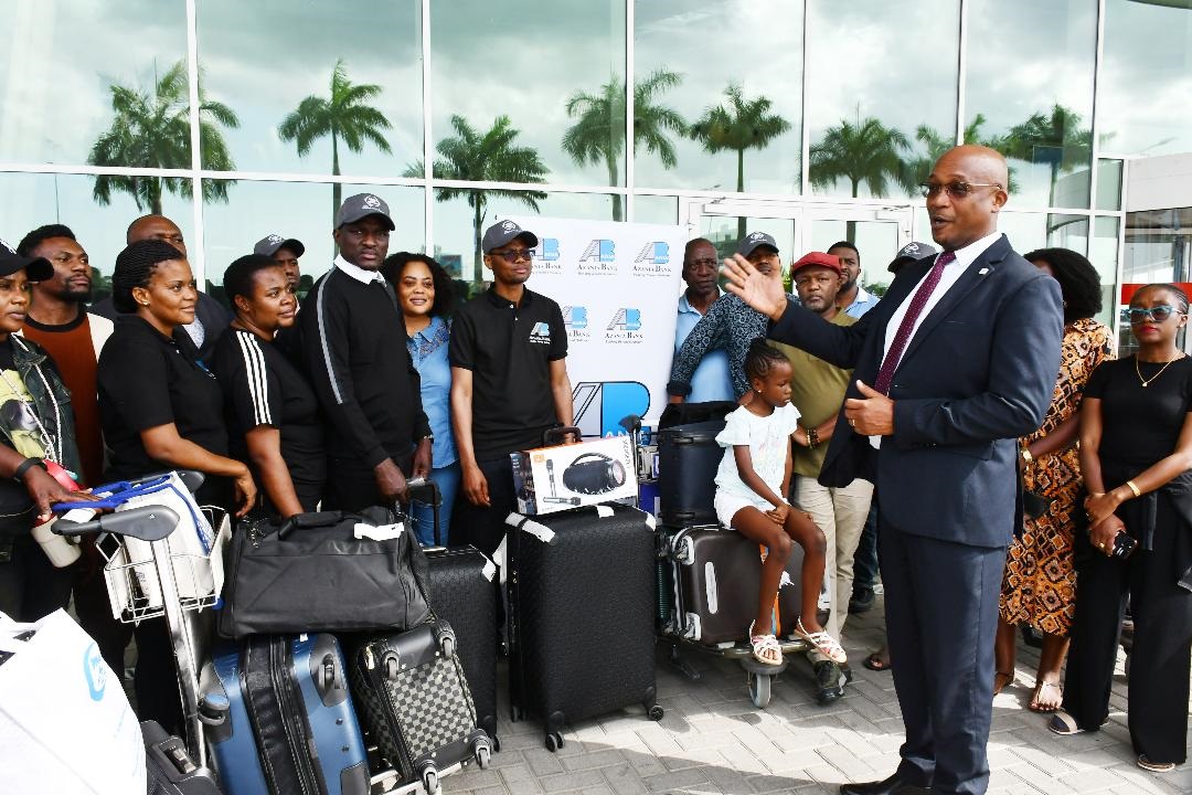 Azania Bank Ltd senior business manager Jackson Lohay speaks to a delegation of businesspeople, its customers, after their arrival from China at the Julius Nyerere International Airport late on Tuesday