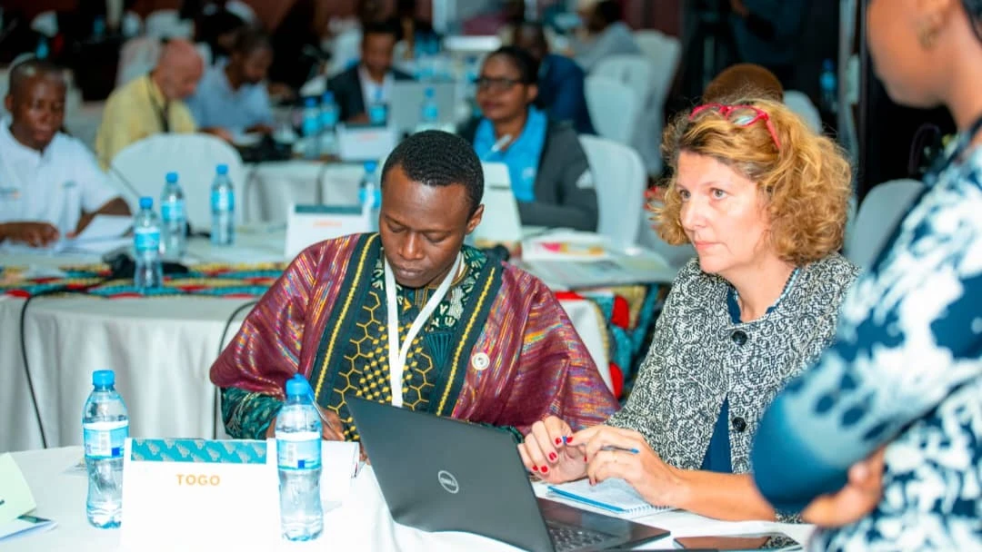 Land Tenure Expert, Da Passano Guglielma making a contribution at CIGOFA 4 conference. Left is Innocent Antoine Houedji, Executive Director of Youth Initiative for Land in Africa (Yilaa)