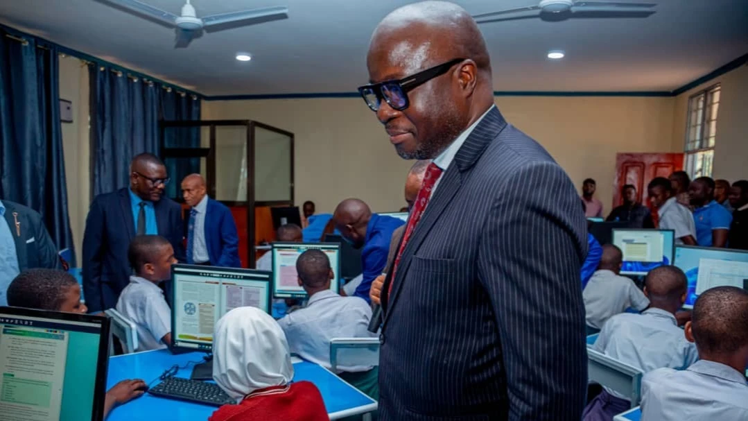 
Dr. Nkundwe Mwasaga (right), ICT Commission director general witnesses students busy in the modern ICT lab at Manushi Secondary School in Manushi village in Moshi District, Kilimanjaro Region.

