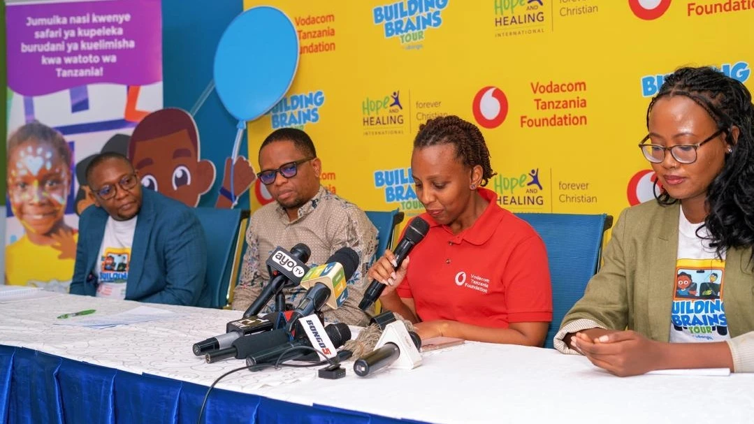 Sandra Oswald (second right), Vodacom Tanzania Foundation Manager, addressing journalists during the launch of the Building Brains Tour 2024. Left is Hamis Mwinjuma, Deputy Minister for Culture, Arts and Sports. 