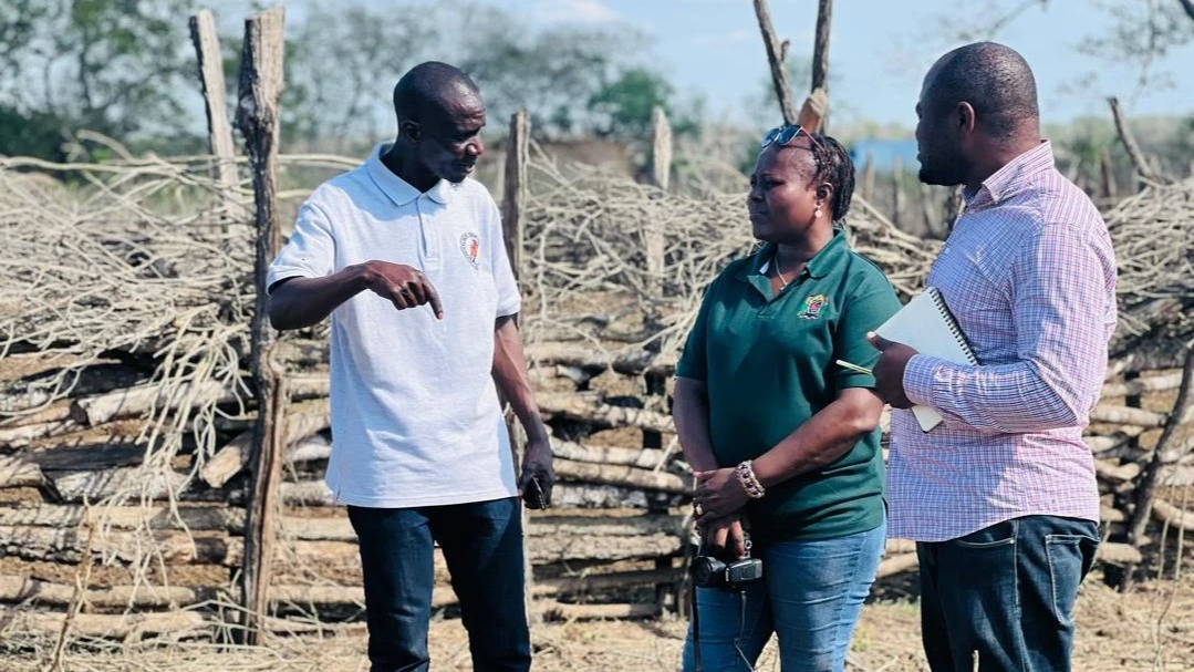 Musa Kumbi, the chairman of the Msanja Ward Forest Conservation Network (HIMIMSA) (L) explains on how masaai herders have built house and cattle shed  to  Elida Fundi, MJUMITA’s  good governance and advocacy officer (2nd R) and  Adam  Sylvester.