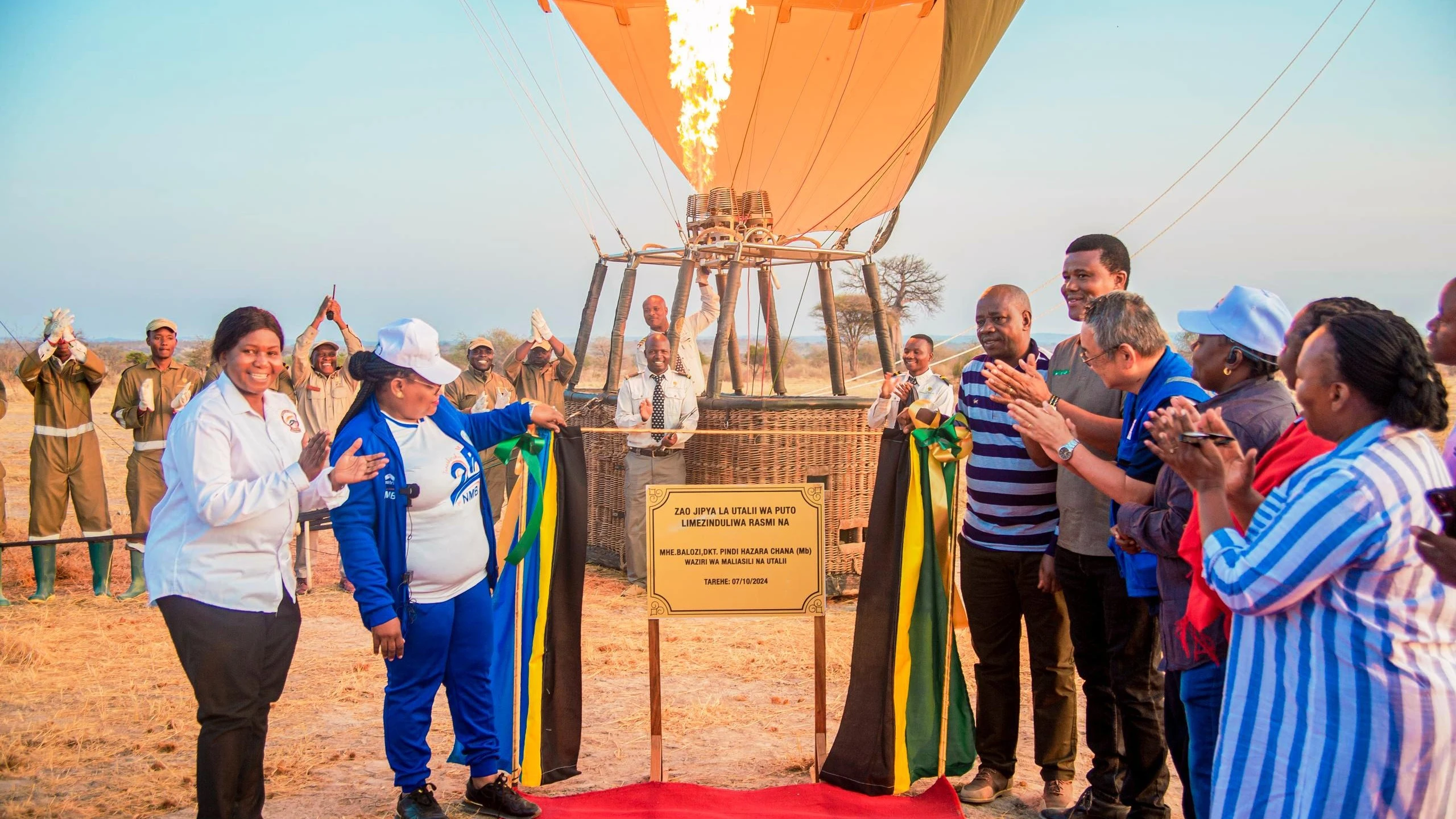 Natural Resources and Tourism minister Dr Pindi Chana (2nd-L), along with various leaders from the ministry graces the launch of a parachute tourism initiative in the Ruaha National Park yesterday in marking the wildlife sanctuary’s 60th anniversary.