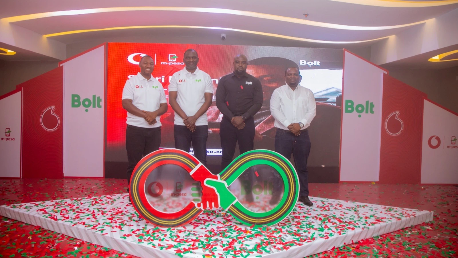 Vodacom's Head of Merchants, Kilian Kamota, M-Pesa Director Epimack Mbeteni, Bolt Tanzania General Manager Dimmy Kanyankole, and Senior Manager Milu Kipimo at the launch of a partnership between Vodacom and Bolt to boost financial inclusion in Tanzania.