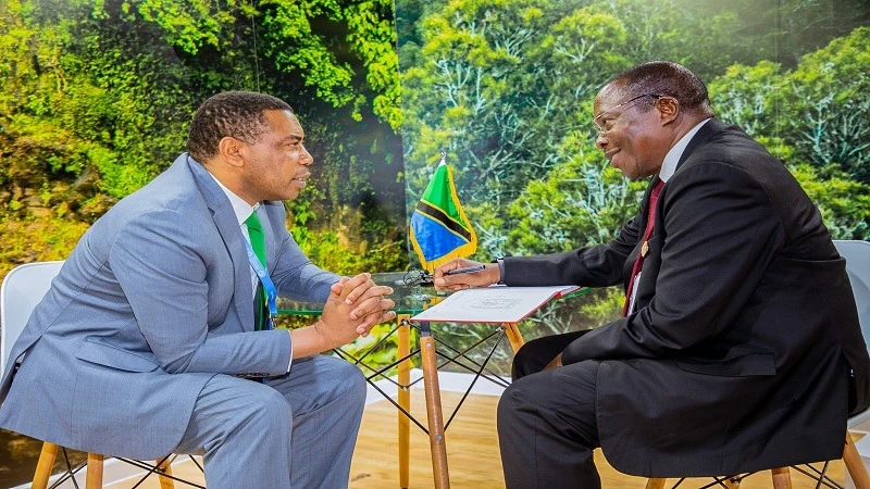 Vice President Dr Philip Mpango exchanging views with Dr Mwigulu Nchemba, the Finance minister at the country’s exhibition booth in the Baku sports complex during the 29th conference of the parties (COP29) to the United Nations Framework Convention.