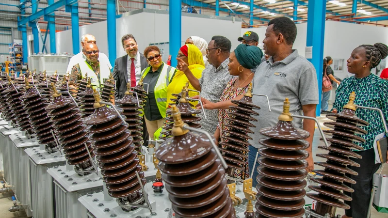 The committee members toured the factories to assess the implementation of workplace safety and health laws.