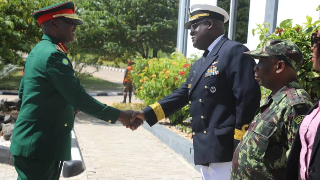 Major General Idd Nkambi (L), the General Officer Commanding of the Tanzania People's Defence Forces (TPDF), greets Rear Admiral Gottlieb Pandeni, Commandant of the Southern African Development Cooperation Regional Peacekeeping Training Centre (SADC RPTC)