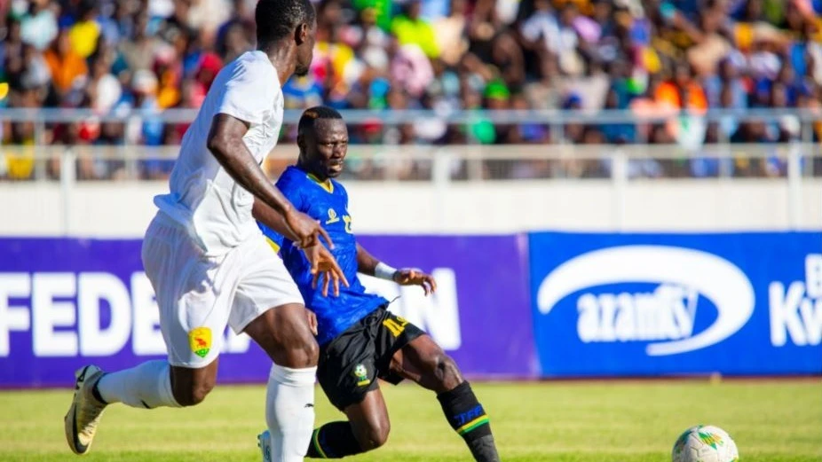 Taifa Stars forward Saimon Msuva pictured yesterday negotiating his way past a Guinea defender during their AFCON qualifier held at the Benjamin Mkapa Stadium in Dar es Salaam.