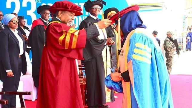 In his capacity as Chancellor of Mzumbe University, Dr Ali Mohamed Shein confers an Honorary Doctorate in Leadership on President Samia Suluhu Hassan at the university’s 23rd graduation ceremony held on the outskirts of Morogoro municipality yesterday. 