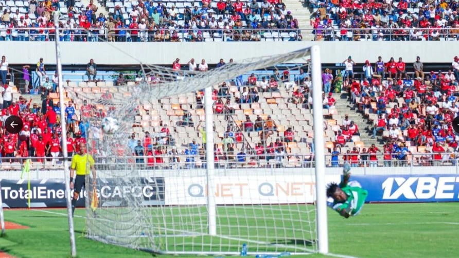 Bravos do Maquis goalkeeper Landu Mavanga is pictured attempting to stop Simba attacking midfielder Jean Charles Ahoua's penalty during the CAF Confederation Cup Group A match at the Benjamin Mkapa Stadium in Dar es Salaam yesterday. 