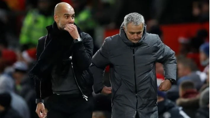 Manchester City manager Pep Guardiola and Manchester United manager Jose Mourinho at the end of the Premier League match at Old Trafford, in Manchester, Britain on December 10, 2017. 