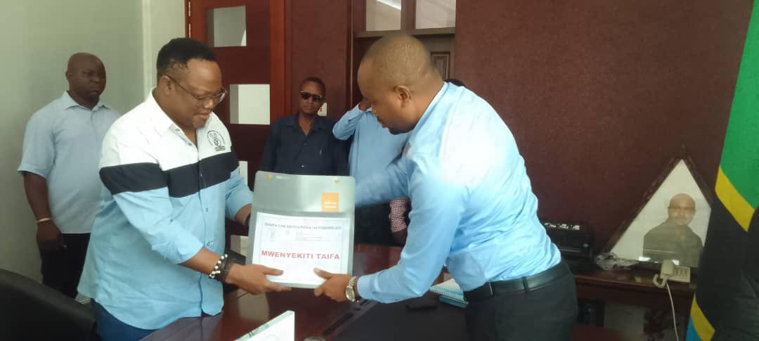 Opposition Chadema Secretary General John Mnyika (R), pictured in Dar es Salaam yesterday presenting forms to Vice Chairman (Mainland) Tundu Lissu for nomination as an aspirant for the party’s national chairmanship in upcoming elections. 