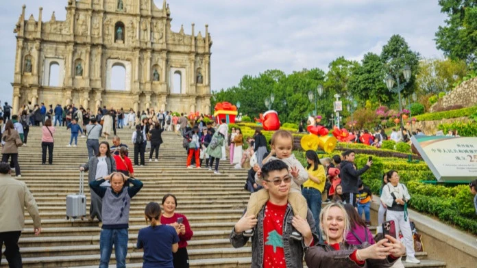 Tourists visit the Ruins of St. Paul's in south China's Macao, Dec. 12, 2024. 