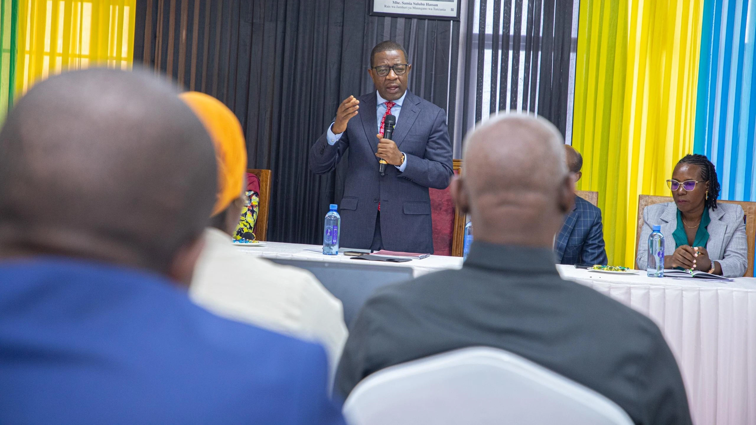 Works minister Abdallah Ulega has a word with members of the Tanzania National Roads Agency (Tanroads) management team at a working session in Dodoma city yesterday. 