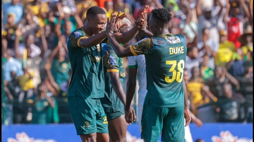 Young Africans striker Prince Dube celebrates his third goal with his teammate Duke Abuya during their Premier League match against Mashujaa FC held at KMC Complex yesterday.