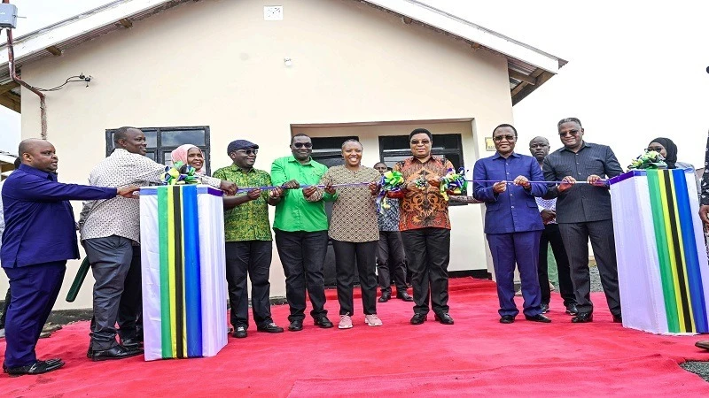 Prime Minister Kassim Majaliwa pictured yesterday cutting the ribbon at Wareti in Hanang District, Manyara Region, to mark the completion of the construction of 109 houses now ready for handing over to the victims of the landslides.