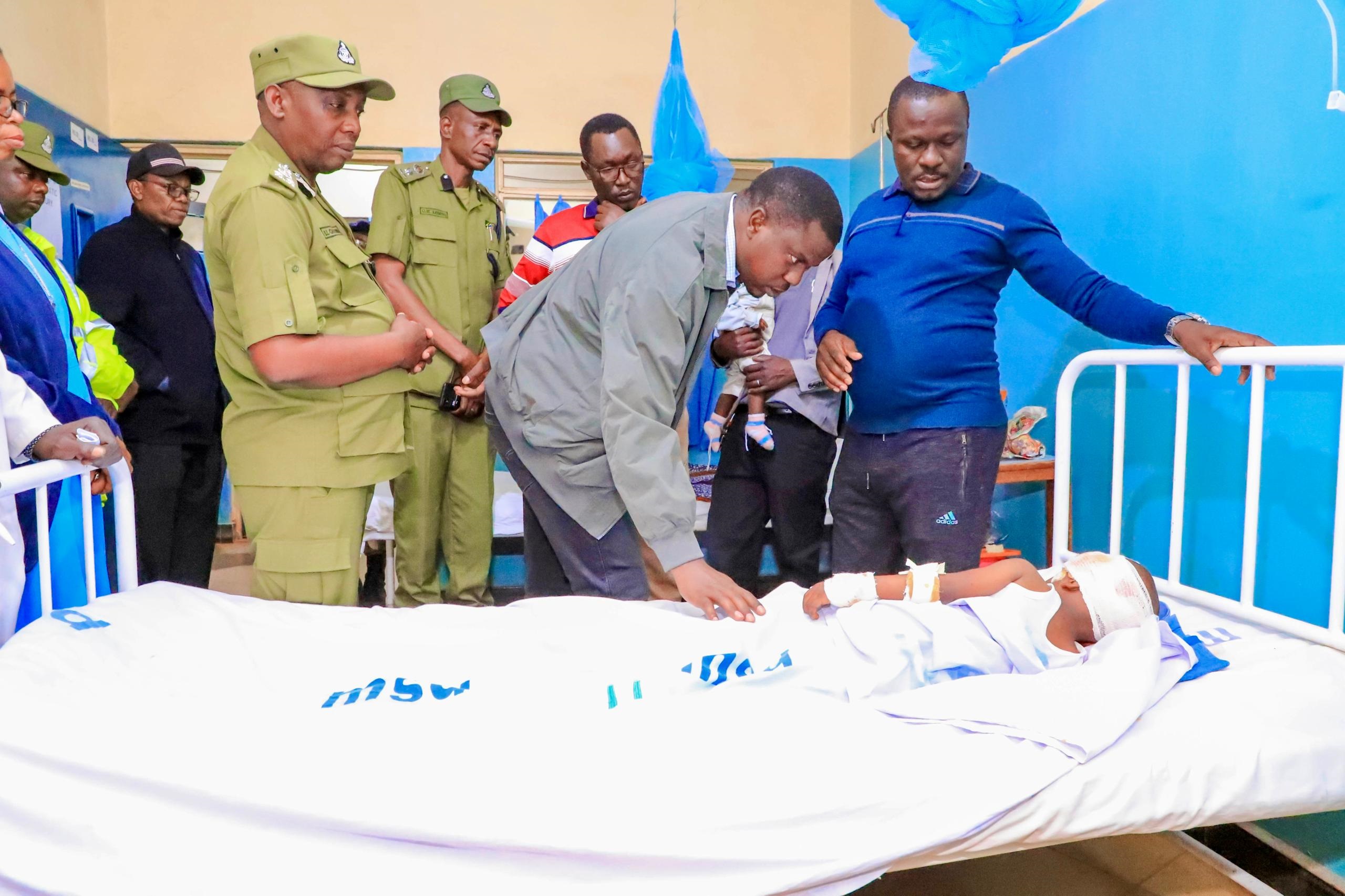 Home Affairs minister Innocent Bashungwa (2nd-R) pictured yesterday consoling one of the people who were on board the bus involved in Saturday’s fatal accident at Kabukome in Nyarubango ward, Biharamulo District, and are now admitted to hospital.