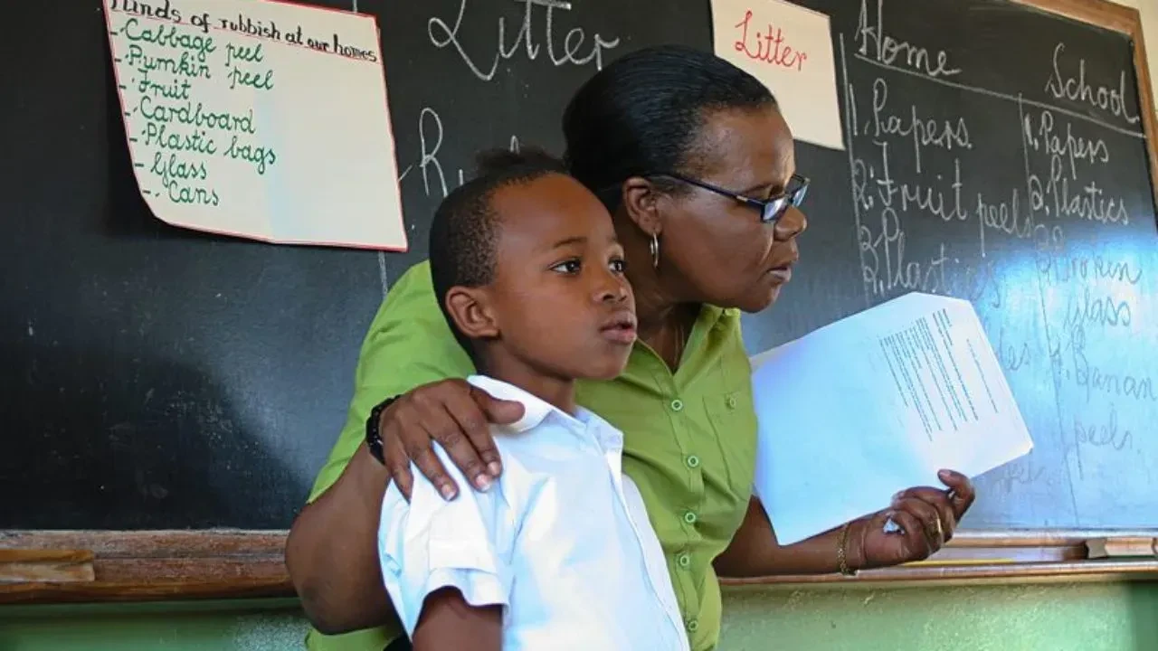 A teacher and a pupil in class