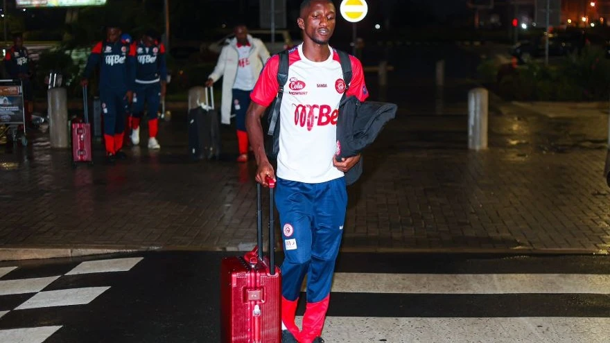 Simba Sports Club players are pictured yesterday morning arriving at the Julius Nyerere International Airport ready for their trip to Tunisia. 