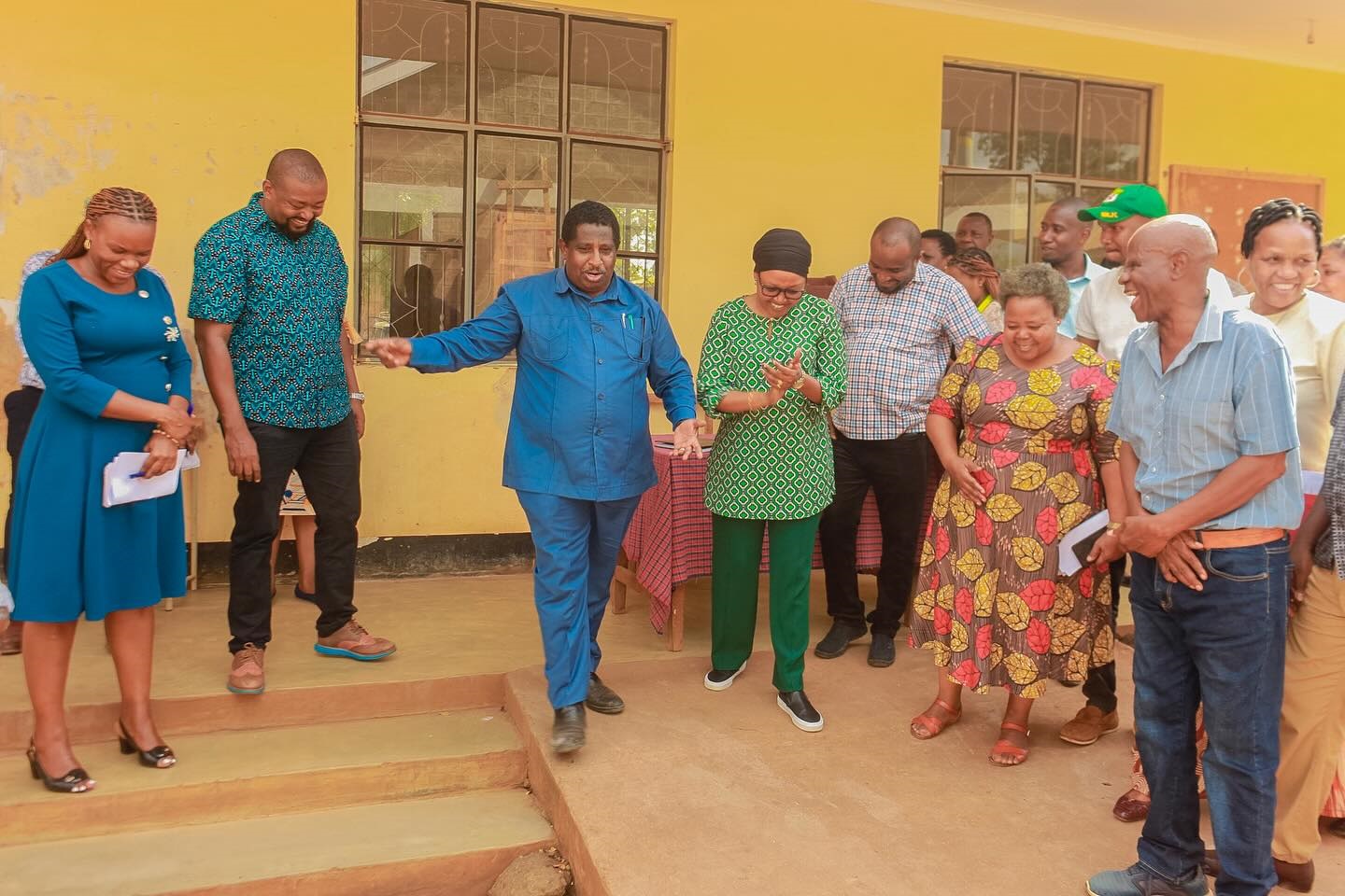  Kilimanjaro regional commissioner, Nurdin Babu (3rd L) sharing a moment of joy with Moshi Urban MP, Priscus Tarimo (2nd L) during a visit to assess the progress of the construction of a new Secondary School at Kaloleni Ward recently. 