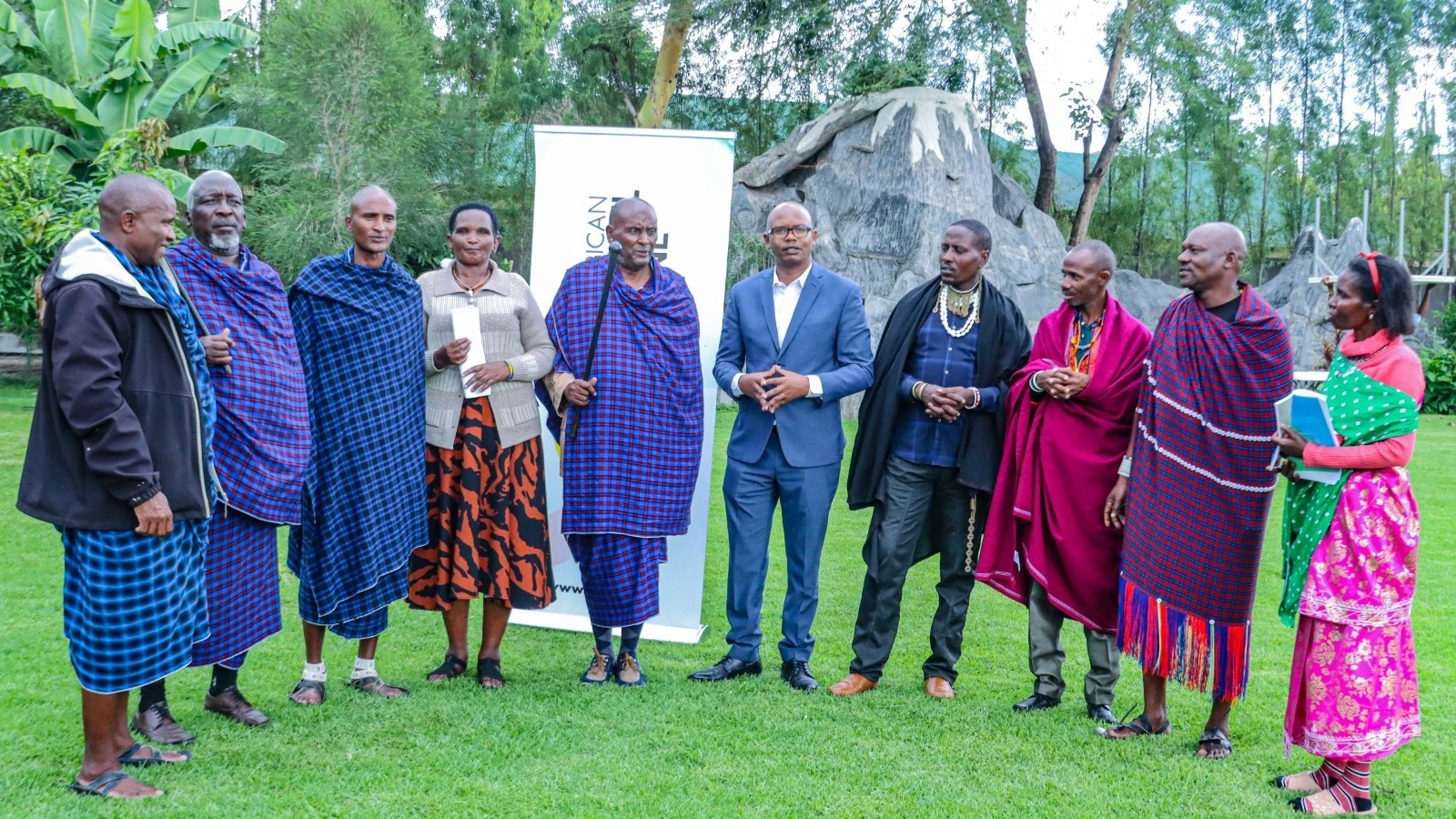 The Advisor for Indigenous Communities from the East African Crude Oil Pipeline (EACOP) Project, Dr. Elifuraha (centre, wearing a suit), taking to   national leaders of indigenous communities during the fourth quarterly meeting held in Arusha