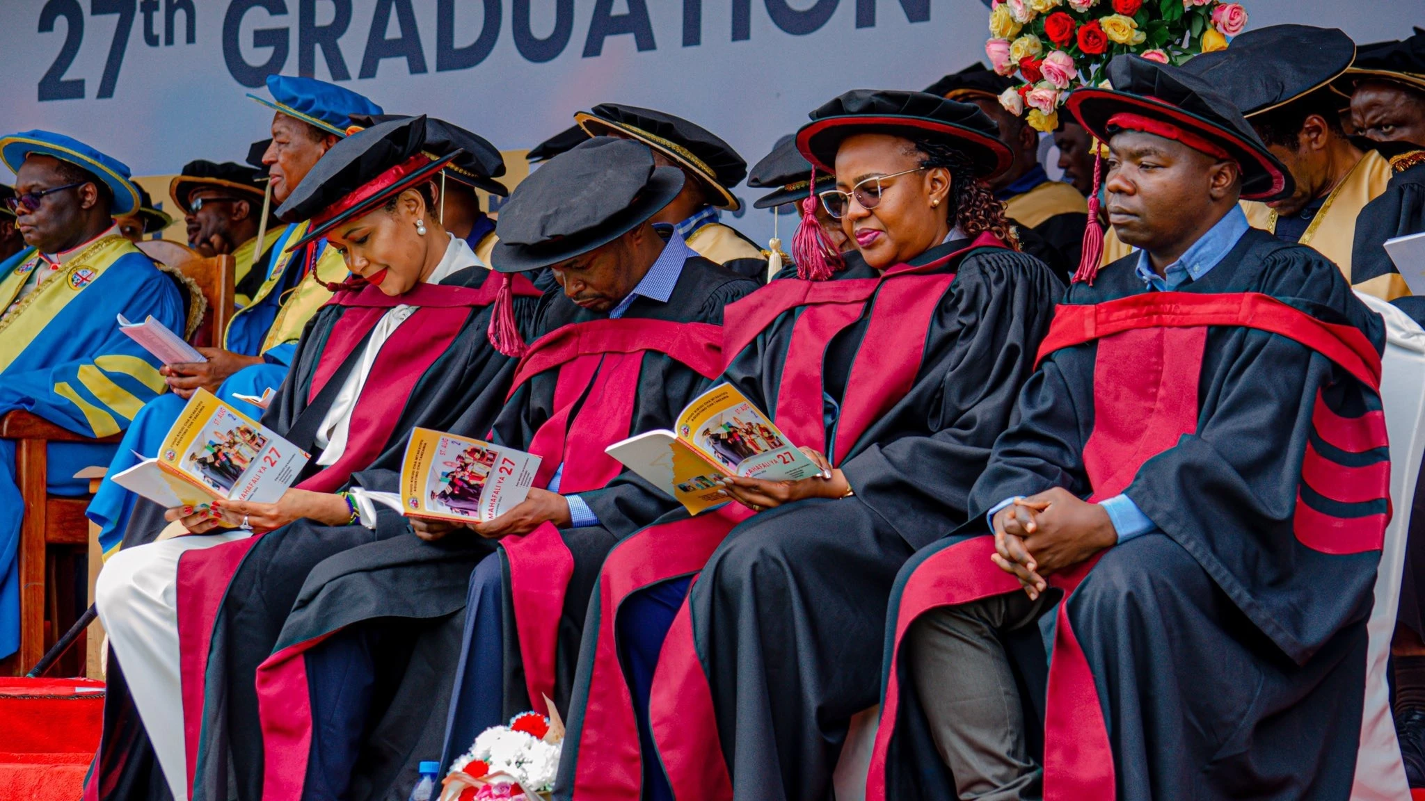 Lecturers and graduates attend a graduation ceremony at Saint Augustine University on December 21st 2024 