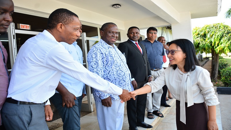 Ambassador Chen exchanges greetings with TGL Finance Manager Samuel Organess after her arrival. Others are The Guardian Newspaper Managing Editor Wallace Mauggo (2nd L) and TGL DGM Jackson Paulo.