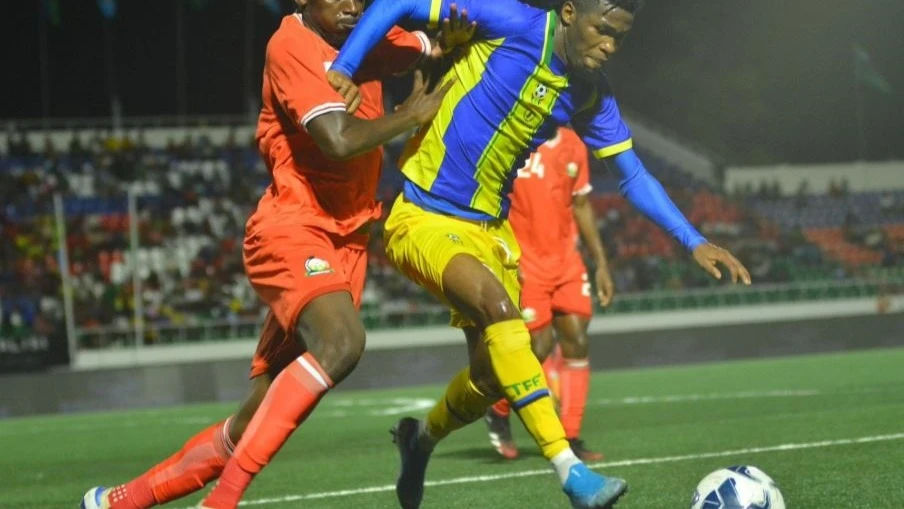 
Kilimanjaro Stars and Kenya players battle for the ball during their 2025 Mapinduzi Cup group stage match at Gombani Stadium, in Pemba Island, on Tuesday. Kenya won 2-0.