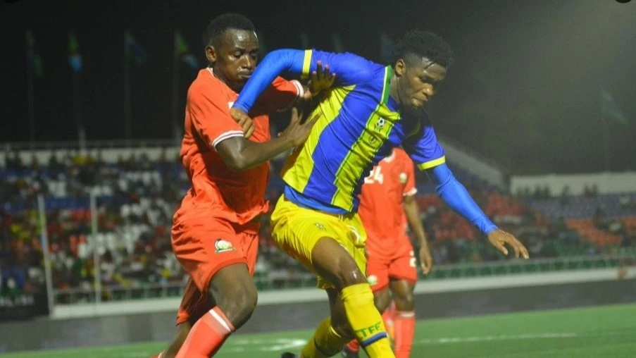 Kilimanjaro Stars and Kenya players battle for the ball during their 2025 Mapinduzi Cup group stage match at Gombani Stadium, in Pemba Island, on Tuesday. Kenya won 2-0. 