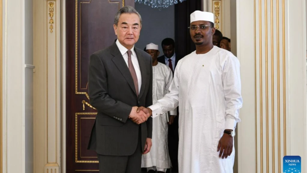 Chadian President Mahamat Idriss Deby Itno (R, Front) shakes hands with Chinese Foreign Minister Wang Yi, also a member of the Political Bureau of the Communist Party of China Central Committee, during their meeting in N'Djamena, Chad, on Jan. 8, 2025.