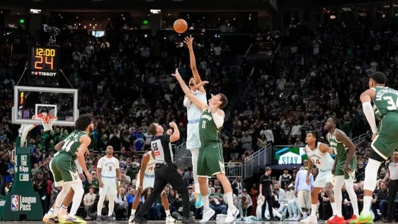 San Antonio Spurs forward Victor Wembanyama (1) leaps for the opening tipoff over Milwaukee Bucks center Brook Lopez (11) during the first quarter at Fiserv Forum in Milwaukee, Wisconsin, USA; on Jan 8, 2025. 