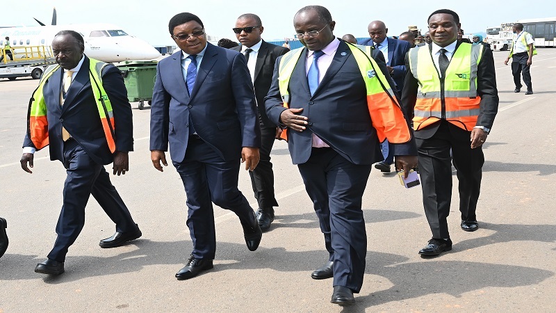 Prime Minister Kassim Majaliwa, accompanied by Uganda’s Minister of State for Agriculture, Livestock and Fisheries, Fredrick Bwino Kyakulaga (R), shortly after arriving at the Entebbe International Airport yesterday. 