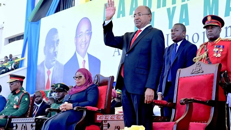 Zanzibar President Dr Hussein Ali Mwinyi waves to the audience at the climax of the weeklong events to mark 61 years of Zanzibar Revolution at Gombani Stadium in Chakechake, Pemba South Region yesterday. 