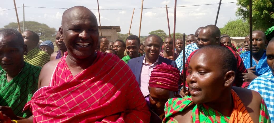 Chairman of CCM in Simanjiro District, Manyara Region, Kiria Laizer (C), is welcomed by residents of Naepo Village led by their Chairman Elias Laizer (R) during a thanksgiving celebration for a peaceful local government election at the weekend. 