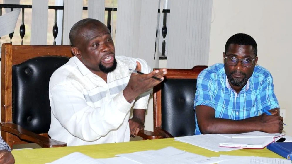 Malinyi District Council Director in Morogoro Region, Khamis Katimba (L), speaks during the launch of the district's Workers' Council on Wednesday. 